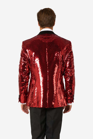 Back view of a red sequin blazer with black lapels, worn with black trousers.