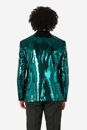 Back view of a man wearing a teal sequin blazer with black satin lapel and black dress pants.