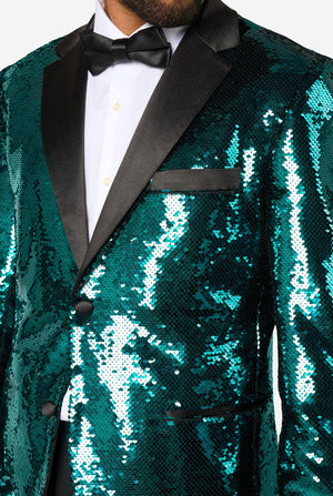 Close-up of the upper chest of a teal sequin blazer with black satin lapel, breast pocket, and black bow tie.