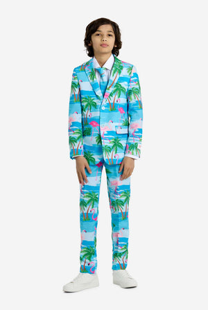 Child wearing a colorful tropical-themed suit on a white background, full body image