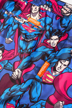 Men's Superman-themed swim shorts featuring a bold comic book design with multiple action poses of the Man of Steel. Perfect for superhero fans looking to make a splash. Close up pockets.