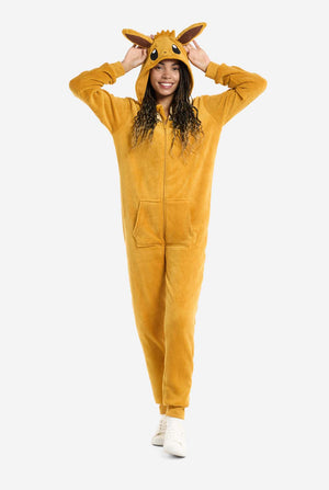 A woman is wearing an adorable Eevee onesie, modeled after the beloved Pokémon character. This adult unisex onesie is designed in a warm brown color, resembling Eevee’s fur, and features a fluffy beige collar mimicking Eevee’s mane. The hood includes Eevee's signature large brown ears, big black eyes. The onesie has a front zipper closure and convenient pockets at the front, offering both comfort and ease of wear. Perfect for Pokémon fans, this cozy fleece onesie is ideal for lounging or cosplay.