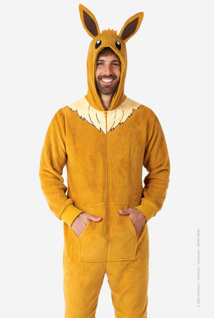 A man is wearing an adorable Eevee onesie, modeled after the beloved Pokémon character. This adult unisex onesie is designed in a warm brown color, resembling Eevee’s fur, and features a fluffy beige collar mimicking Eevee’s mane. The hood includes Eevee's signature large brown ears, big black eyes. The onesie has a front zipper closure and convenient pockets at the front, offering both comfort and ease of wear. Perfect for Pokémon fans.