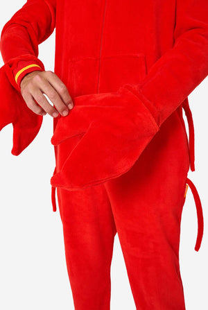 A man is wearing a bright red lobster-themed adult onesie featuring playful hood details and cozy, soft material, perfect for lounging or costume events. including stitched gloves as claws. Gloves Close-up.