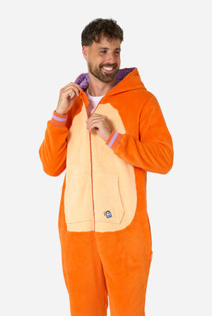 A smiling man is wearing an orange adult onesie designed as a red cat onesie. The onesie features a hood resembling a cat's head, and cat details, perfect for cozy lounging or costume parties. The hood is on his back.