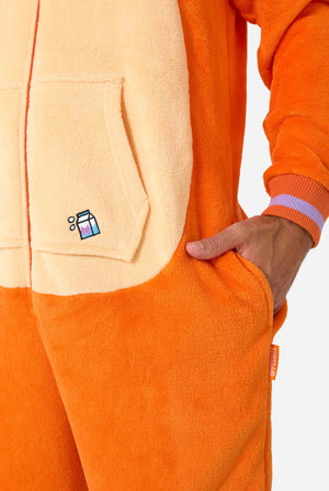 A smiling man is wearing an orange adult onesie designed as a red cat onesie. The onesie features a hood resembling a cat's head, and cat details, perfect for cozy lounging or costume parties. Close up image.