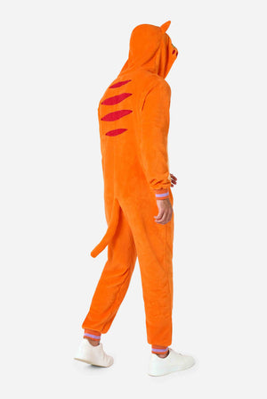 A smiling man is wearing an orange adult onesie designed as a red cat onesie. The onesie features a hood resembling a cat's head, and cat details, perfect for cozy lounging or costume parties. Full body image from the back with hood up.
