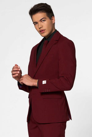 Video of man in Bordeaux red solid color men's suit Blazing Burgundy. Suit consists of blazer, pants and tie.