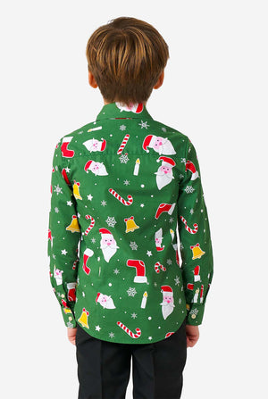 Kid wearing green Christmas shirt with Christmas icons