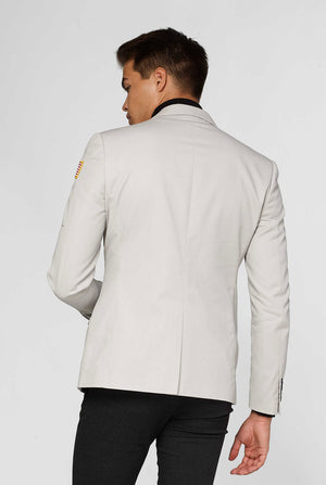 Light grey casual blazer with astronaut themed patches worn by man