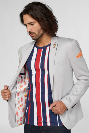 Grey sportswear casual blazer with sports patches worn by man