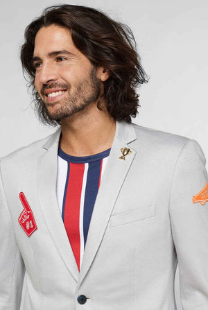 Grey sportswear casual blazer with sports patches worn by man