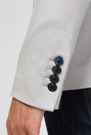 Grey sportswear casual blazer with sports patches worn by man