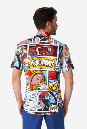 Man wearing summer shirt with Comic book print and blue shorts, view from the back