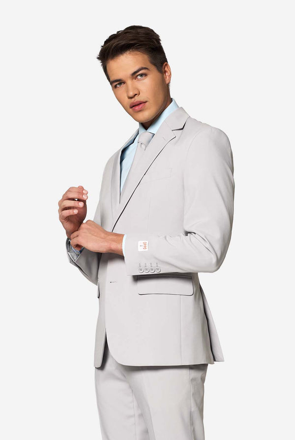 Solid color light grey men's suit Groovy Grey worn by man. Upper body image.
