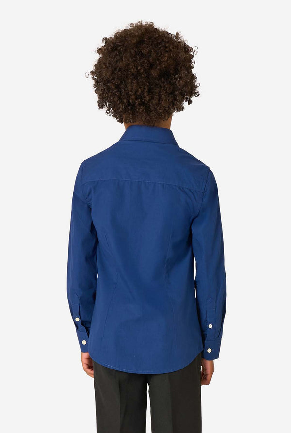 Little kid is wearing a blue shirt and a black pants. View from the back.