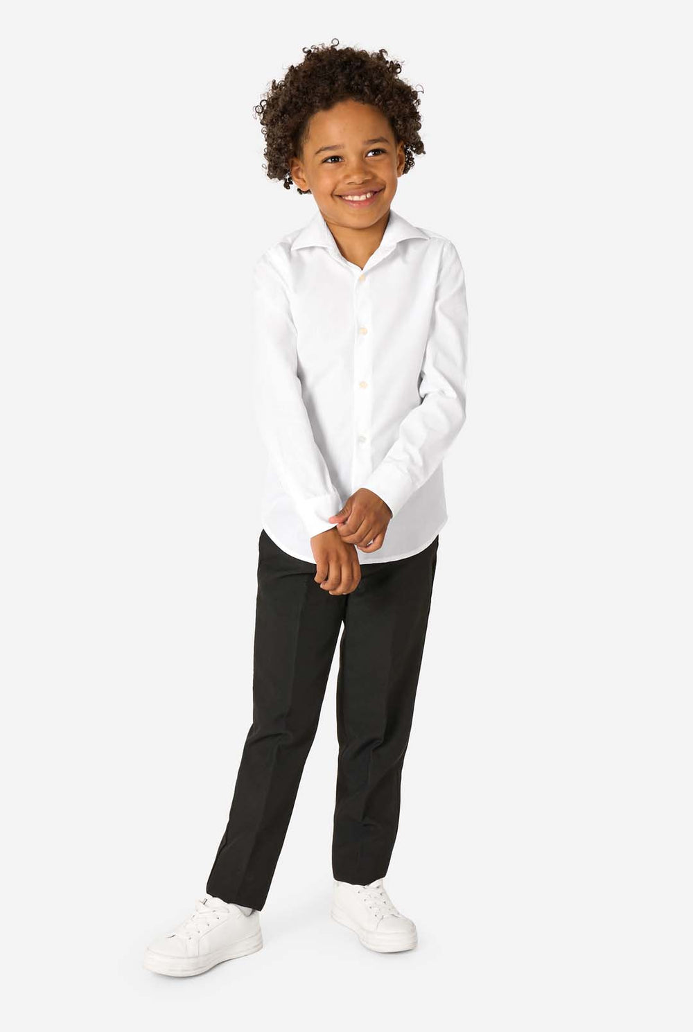 Little kid wearing a white shirt and black pants.