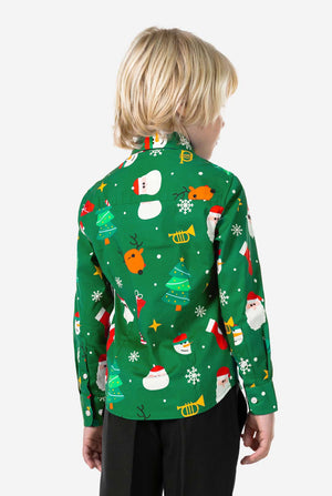Child wearing a green Christmas-themed shirt with various festive designs on a white background