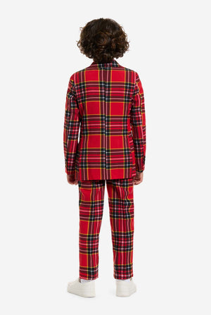 Person wearing a red plaid Christmas outfit on a white background, view from the back.