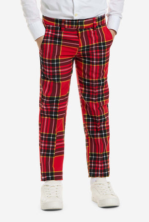 Red plaid pants worn by a person on a white background