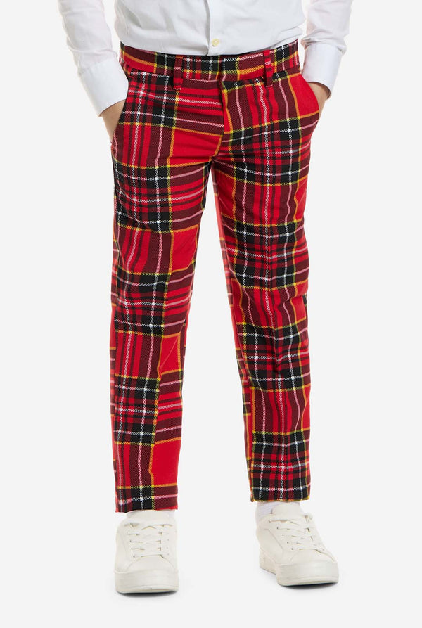 Red plaid pants worn by a person on a white background
