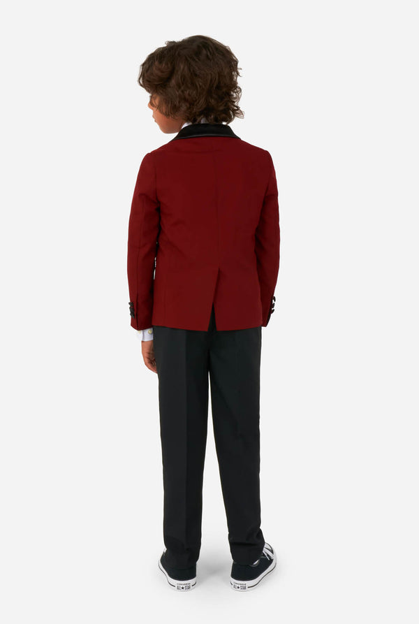 Kid wearing red and black tuxedo, view from the back