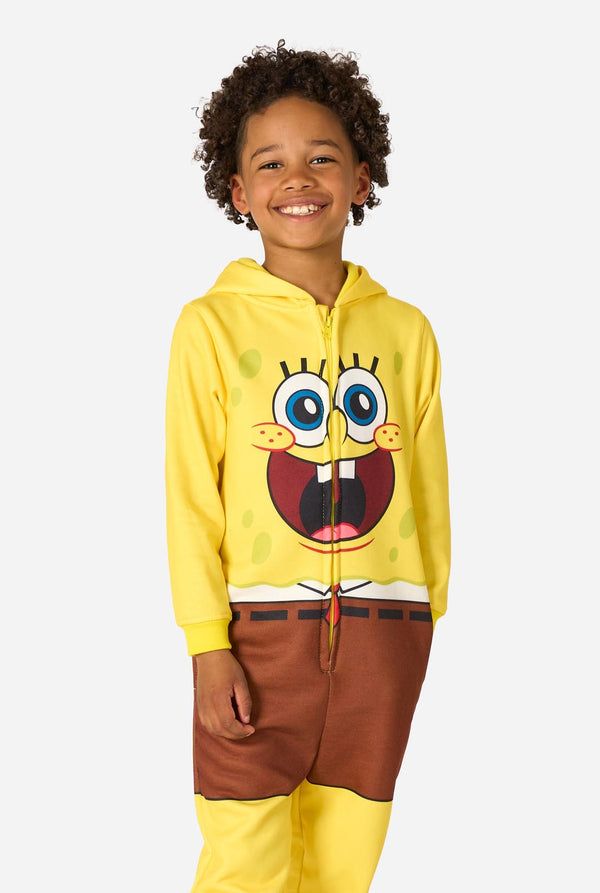Child wearing a yellow SpongeBob onesie with a white background, hood down.