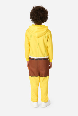 Child wearing a yellow SpongeBob onesie with a white background, viwe from the back