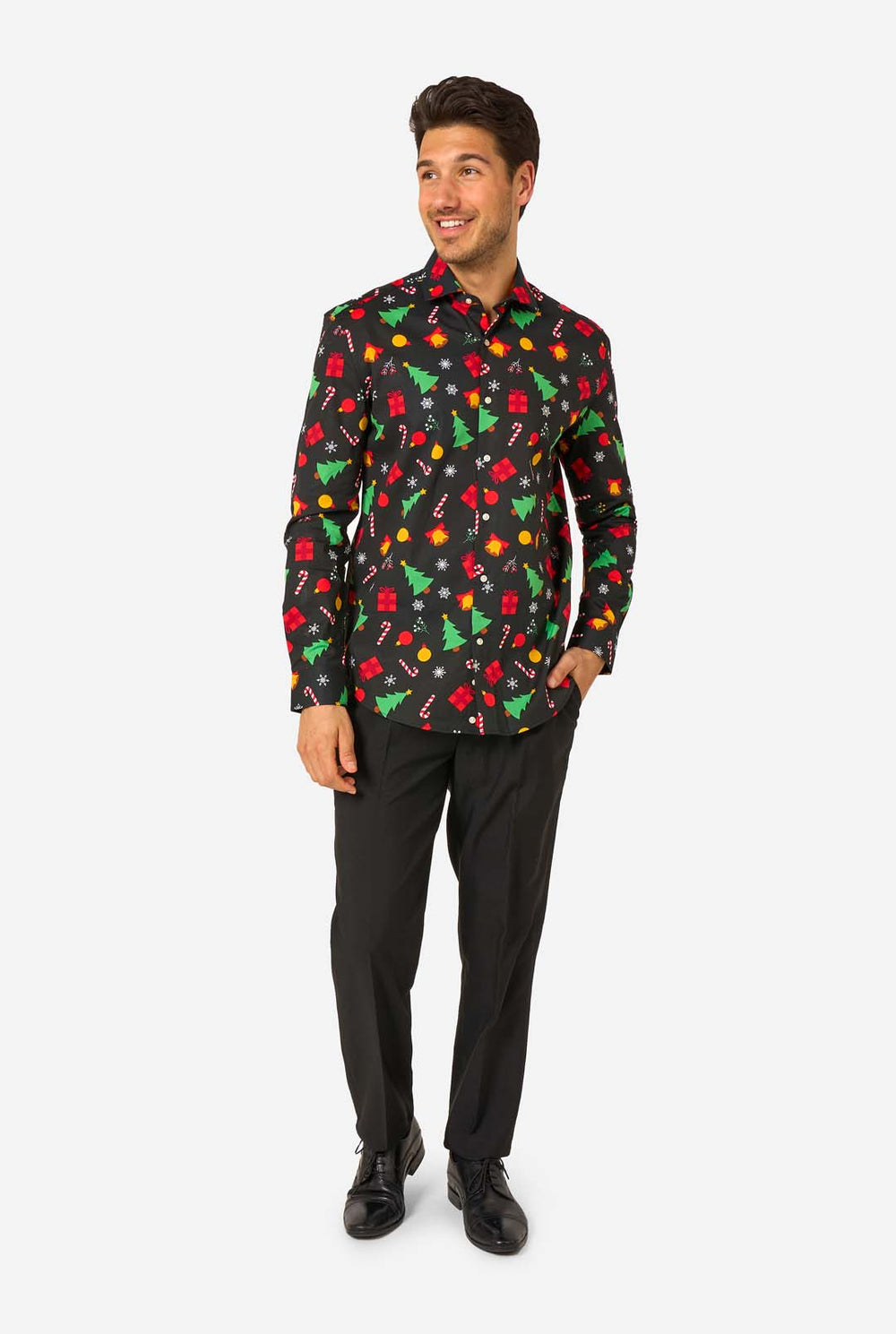 Man wearing a black festive patterned shirt with colorful Christmas designs on a white background