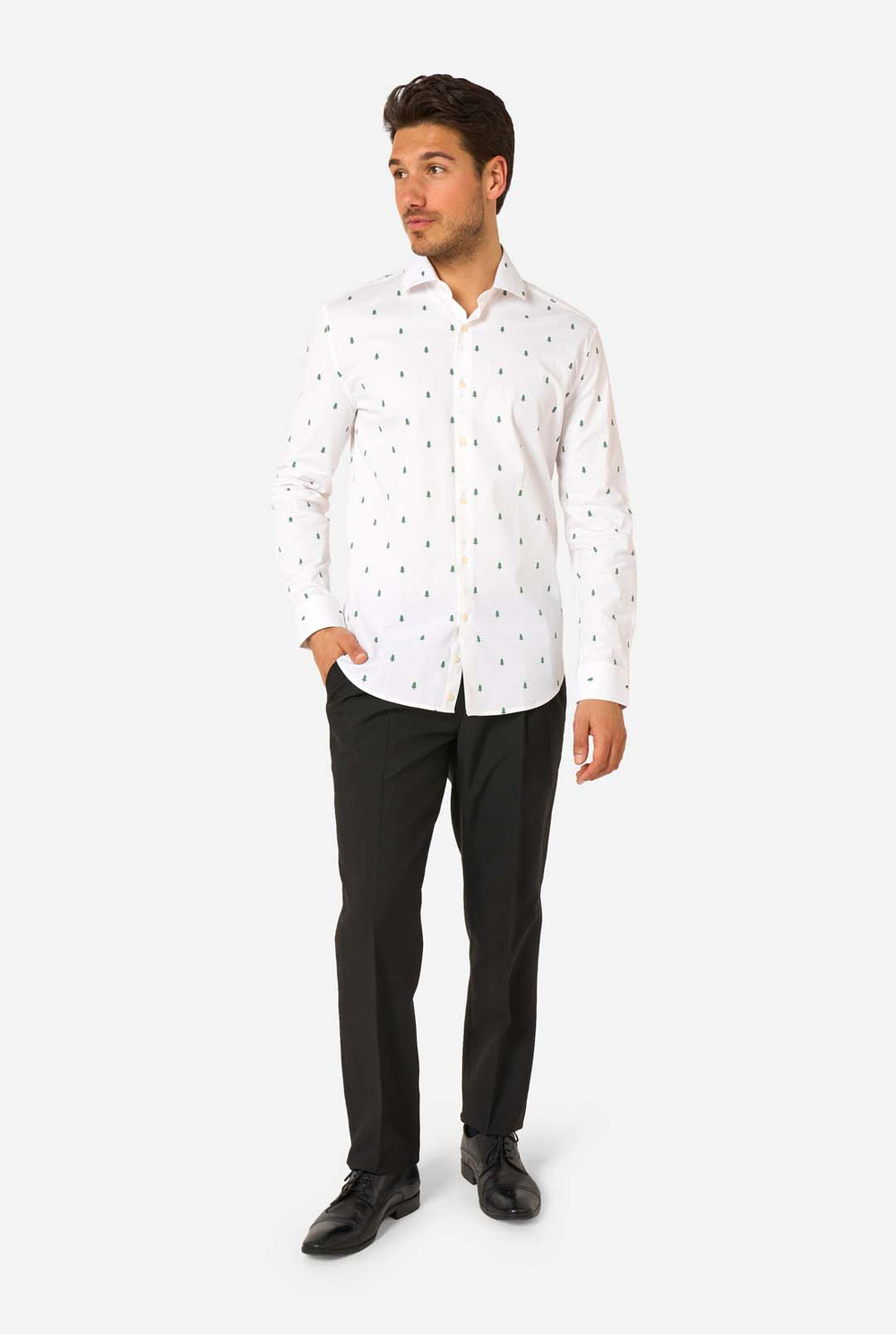 Man wearing a white shirt with a subtle Christmas tree pattern on a white background.