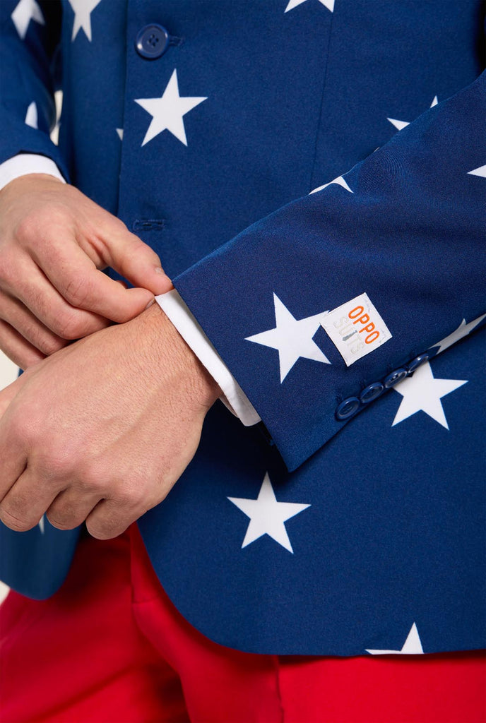 Man wearing red and blue USA themed suit for 4th of July, close up