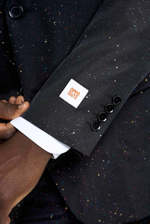 Image of a man wearing an OppoSuits Glitzy Glitter men's suit with glitters and white men's shirt. Suit consist of pants, jacket and tie. Sleeve close-up.
