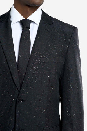 Image of a man wearing an OppoSuits Glitzy Glitter men's suit with glitters and white men's shirt. Suit consist of pants, jacket and tie. Chest close-up.