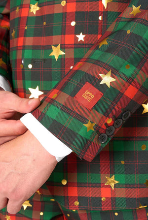Close-up of jacket sleeve showing tartan plaid with gold stars and dots, black buttons, and an OppoSuits brand label stitched above the cuff.