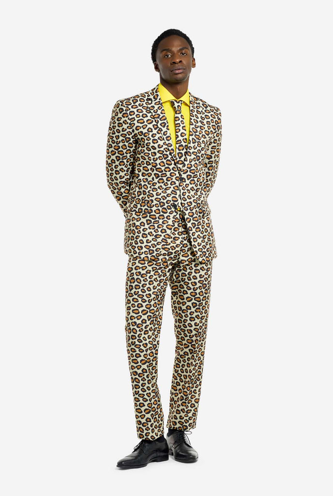 Image of a man wearing an OppoSuits The jag men's suit with panther print and yellow men's shirt. Suit consist of pants, jacket and tie. Full Body image.