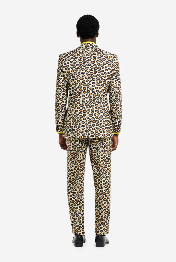 Image of a man wearing an OppoSuits The jag men's suit with panther print and yellow men's shirt. Suit consist of pants, jacket and tie. View from the back.