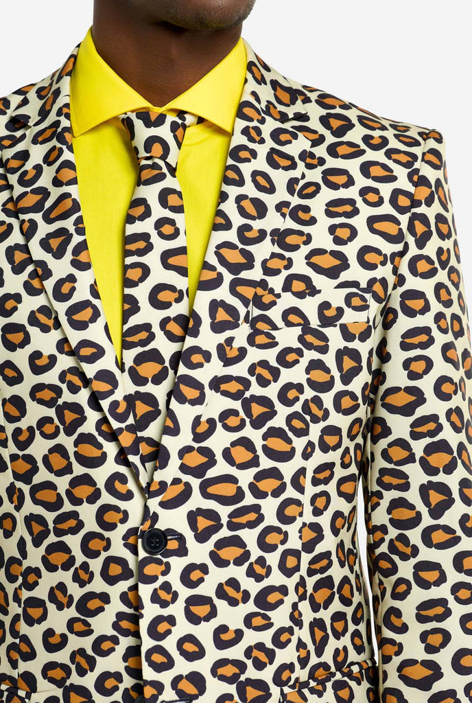 Image of a man wearing an OppoSuits The jag men's suit with panther print and yellow men's shirt. Suit consist of pants, jacket and tie. Chest close-up.