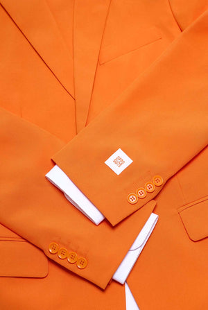 Close-up of an orange suit with a white shirt underneath