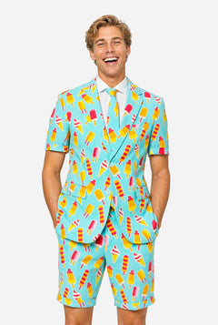 Man wearing light blue summer suit with ice cream and ice loly print. Suits consists of shorts, short sleeved blazer and tie.