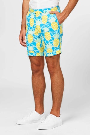 Man wearing blue summer suit with pineapple print. Shorts close-up.
