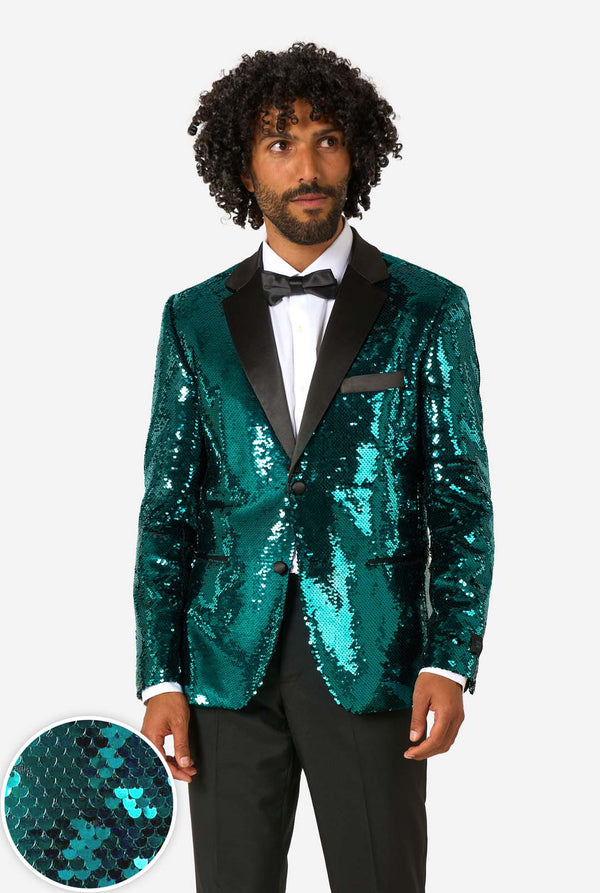 Man wearing a green sequin tuxedo with a close-up of the sequins on a white background