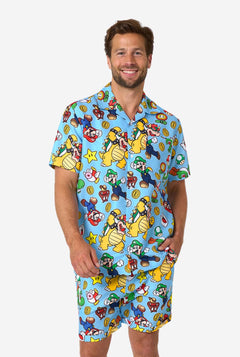 Man wearing a colorful Mario-themed shirt and shorts set on a white background