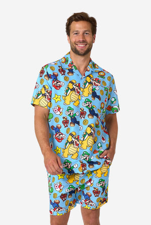 Man wearing a colorful Mario-themed shirt and shorts set on a light background