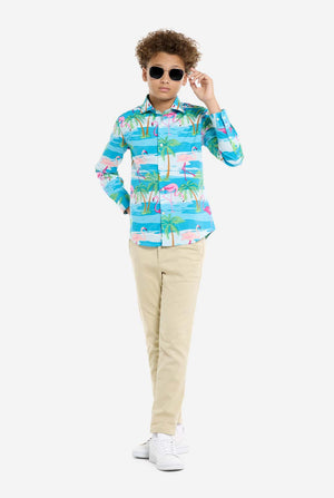 Child wearing a colorful shirt with palm tree design and sunglasses on a white background, full body image