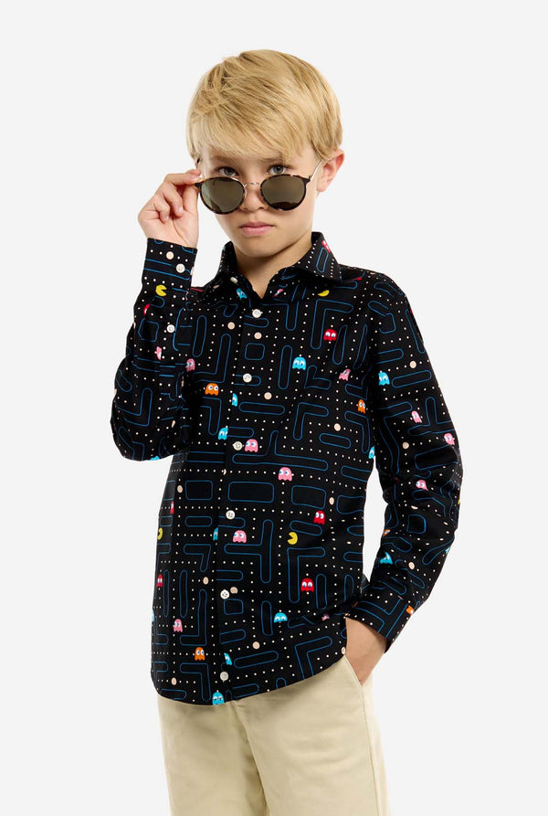 Person wearing a black shirt with colorful patterns and sunglasses on a white background