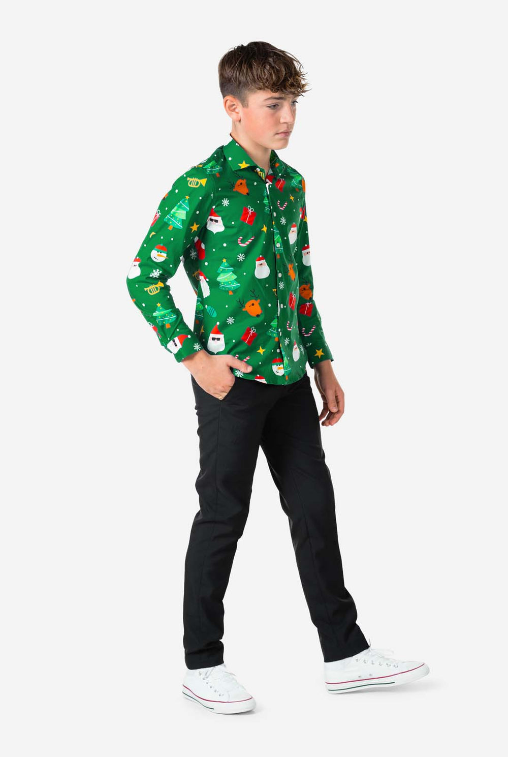 Person wearing a green Christmas-themed shirt with various festive designs on a white background