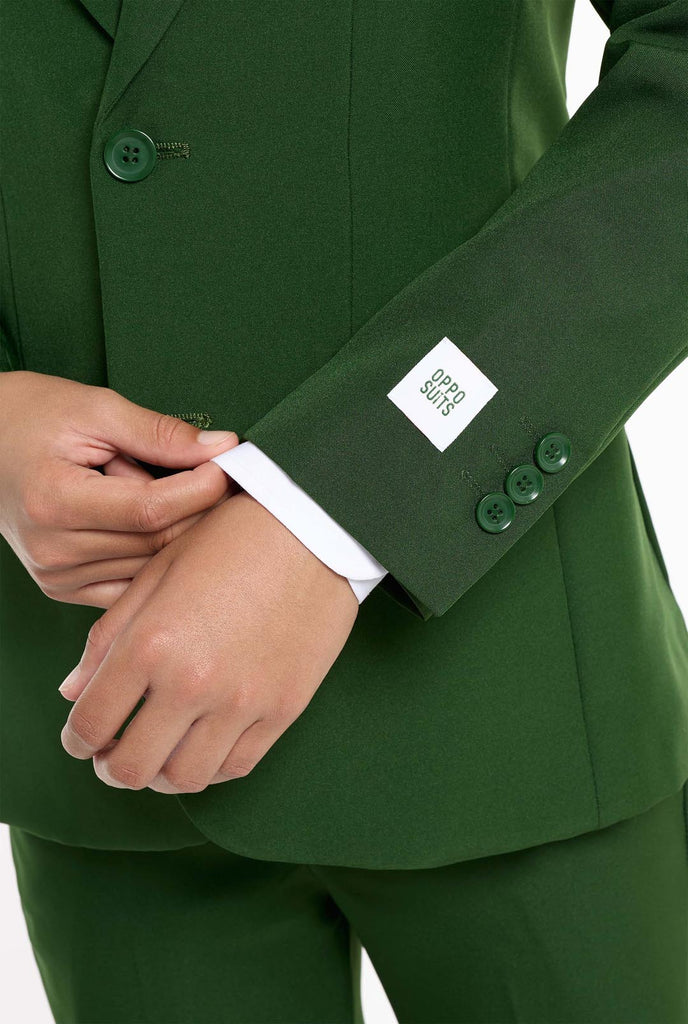 Teen wearing formal dark green suit, close up