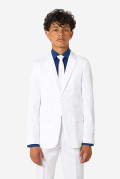 Kid wearing a white suit with a blue shirt on a white background