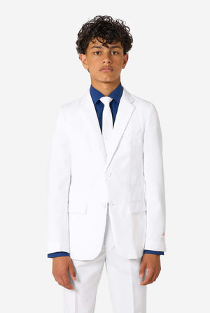 Kid wearing a white suit with a blue shirt on a white background