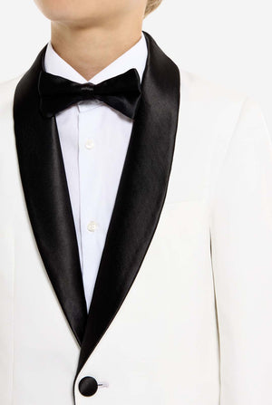 White tuxedo with black lapels and bow tie on a white background
